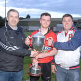 Mattock captain Michael McKeown being presented with the Paddy Sheelan Cup by Des Halpenny (Louth County Board chairman) and Darren McCann (Sheelan family) Pic: Arthur Kinahan)