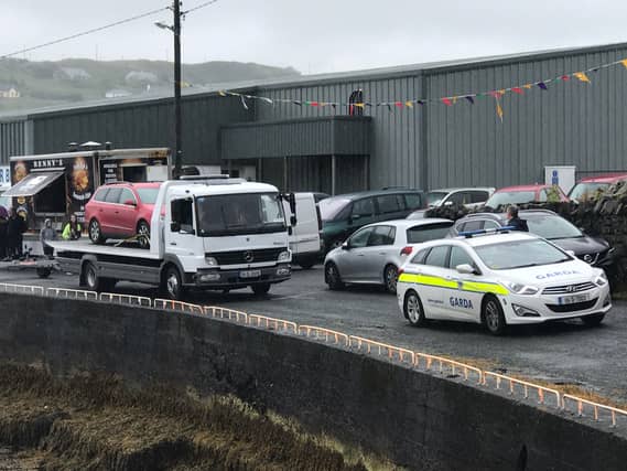 The car which it is understood the two men arrived at Teelin Pier in before their fishing expedition turned to tragedy is taken away from the pier yesterday afternoon.
