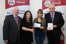 Harry Galvin, (President of NISO), Chris McCormack (Lecturer AIT), Malgorzata Kosel  Award winner, John Flanagan, NISO Midlands Chairperson and Quizmaster holding the booklet Malgorzata designed.