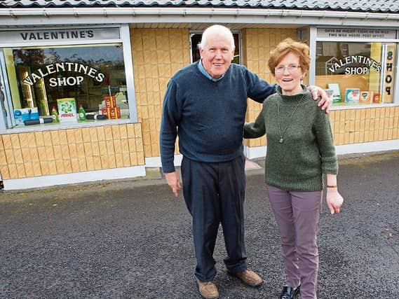 Jim and Abina Valentine pictured outside their shop and post office at Two Mile House shortly before the couple retired