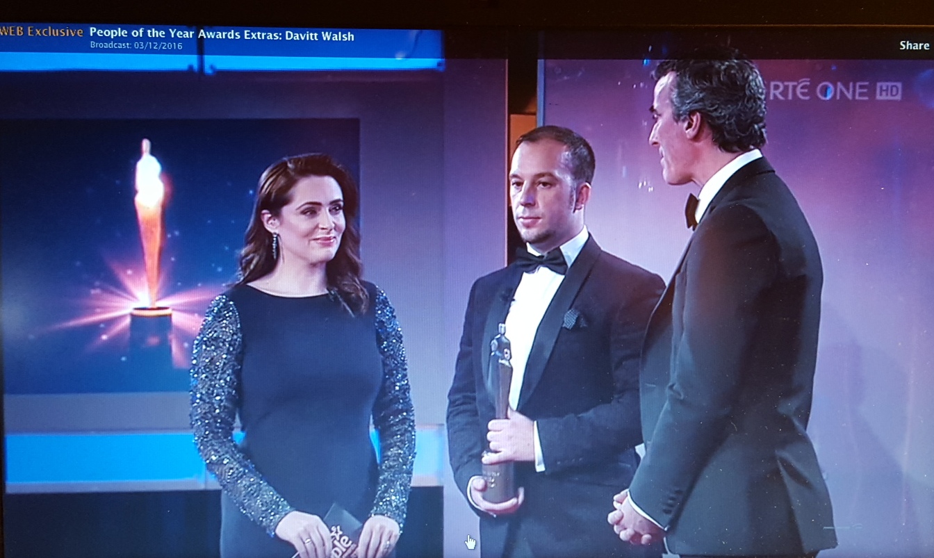 Davitt Walsh receiving his award from Jim McGuinness and host Gráinne Seoige.