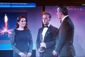 Davitt Walsh receiving his award from Jim McGuinness and host Gráinne Seoige.