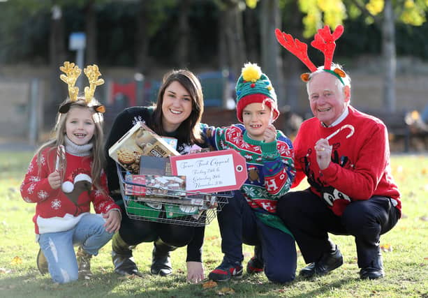 Iseult Ward (CEO & Co-Founder FoodCloud), Joe Smith (Lions Club Coordinator), Ellamay Melia (6) and Lughán Ó Riagáin (8).