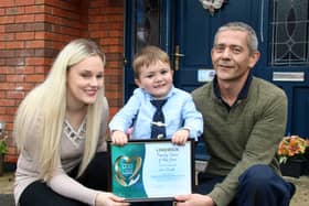 John Joe and Una Quish with their son Noah outside their home in Monaleen.