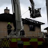 Fire crews dismantling the burnt roof of the house in Esker Hills Portlaoise.