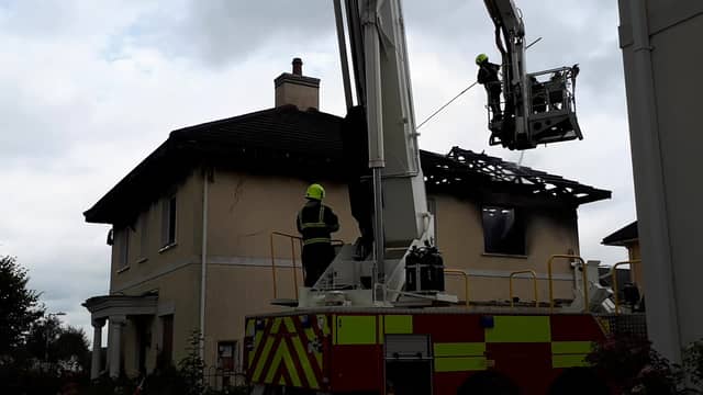 Fire crews dismantling the burnt roof of the house in Esker Hills Portlaoise.