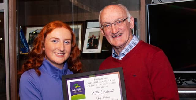 Ella Cantwell receiving life membership from Ray Molloy at Esker Hills Golf Club last year