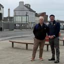 Deputy John Clendennen and Cllr Noel Cribbin with the site of the new Edenderry library in the background