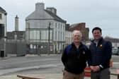 Deputy John Clendennen and Cllr Noel Cribbin with the site of the new Edenderry library in the background