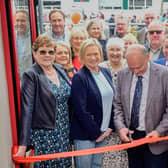 Cutting the ribbon at the Muckalee Shop and Café official opening