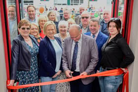 Cutting the ribbon at the Muckalee Shop and Café official opening