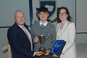 Coláiste Rís 6th Year Student of the Year Oisin Farrell  receiving his award from Fintan Smyth and Ms Catherine Mulhern  Principal of Coláiste Rís. ALL PHOTOS: ARTHUR KINAHAN