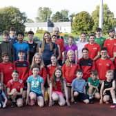 Kelly McGrory with Tir Chonaill AC coaches and athletes. Photos: Joe Boland (North West Newspix)