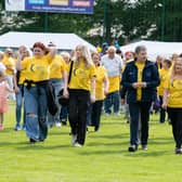 Daniel O'Donnell surrounded by carers as they start their lap at the Donegal Relay For Life Opening at the ATU Letterkenny in 2024. Photo: Clive Wasson