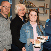 Sadhbh Feely presenting the money she raised from a recent fundraiser to Norita Kemp, a volunteer with NOVAS, also present, Sadhbh's parents, Brian and Elaine Feely Picture: Adrian Butler