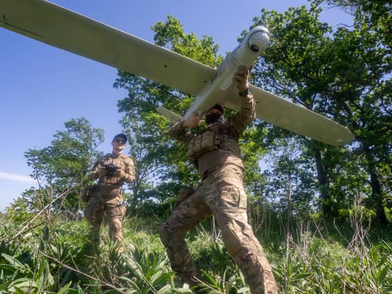 Ukrainian servicemen prepare a drone