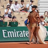 Naomi Osaka walks onto court