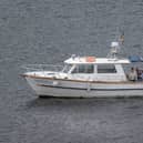 A small white boat on water