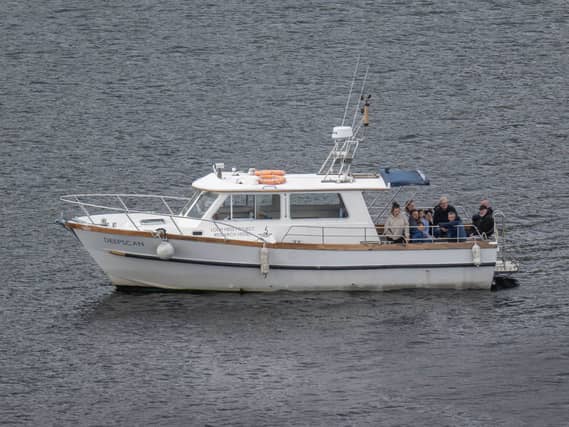 A small white boat on water