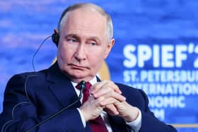 Russian President Vladimir Putin attends a plenary session at the St Petersburg International Economic Forum in St Petersburg, Russia