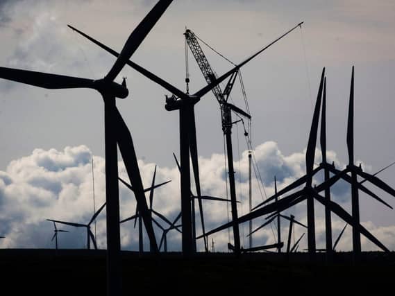 View of a wind farm and cloudy skies