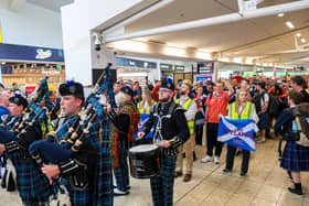 Pipers playing in an airport terminal