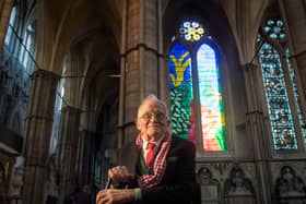 David Hockney in front of a church window