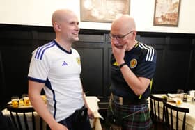 Stephen Flynn and John Swinney wearing Scotland shirts