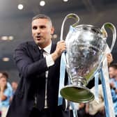 Manchester City chairman Khaldoon Al Mubarak holds the Champions League trophy