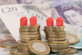 Models of homes on coins