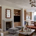 A warm mix of natural textures, soft neutrals and exposed timber brings depth to this living space, reflecting the modern organic look in a calm, understated way