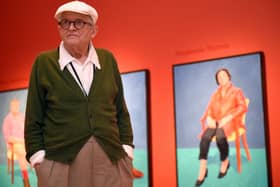 Artist David Hockney poses for photographs in the Sackler Wing at the Royal Academy of Arts