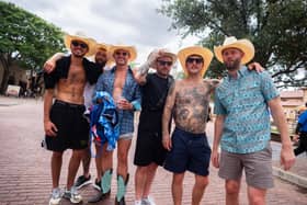 England fans pose for a photo in the Fort Worth Stockyards