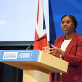 Kemi Badenoch speaking behind a lectern