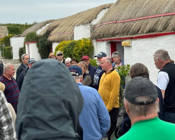 Pat Doherty leading a tour through the Inishowen tourist village.