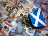 A Saltire-patterned purse with coins