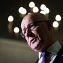 John Swinney with lights around his head