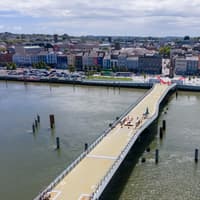 Final surfacing works to begin on new Waterford bridge with red track to be extended