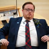 Thomas Kerr seated in Holyrood