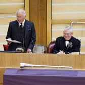 The King delivers a speech next to Presiding Officer Kenneth Gibson MSP and the Queen in the Scottish Parliament