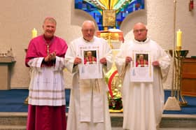 Fr James Sweeney and Fr Seamus Dagens receiving the Papal Blessing from Bishop Niall Coll on behalf of Pope Leo XIV.