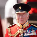The King during the march past in front of Buckingham Palace after the Trooping the Colour ceremony in central London