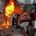 Vehicles set on fire after violence flared in Belfast in June