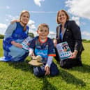 Aoife O'Donohue, Assistant National Director, HSE Disability Services, Donnacha McDonald, a participant in the GAA Cul Camps, and Anne O'Connor, CEO, HSE.