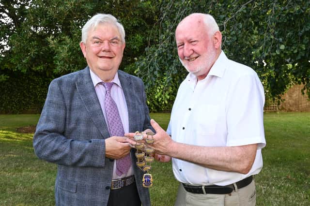 Maurice Regan outgoing President Kilkenny Lions Club handing over the chain of office to Pat Cahill