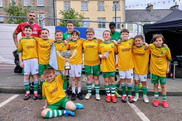 A win-win: The Moville Celtic U-12 Braves celebrate their league title triumph, which came in the middle of the town's best festival ever.