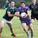 Mohill's Eoghan Duignan challenges Leitrim Gaels' Shane Finn for the ball Picture: Willie Donnellan