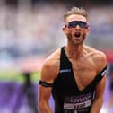 Josh Kerr celebrates breaking the mile world record