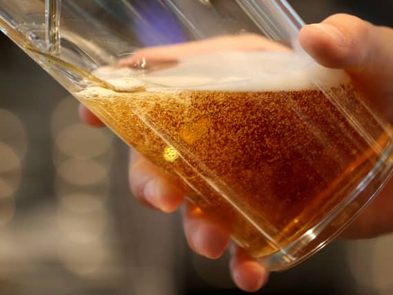 Someone pulls a lovely pint
