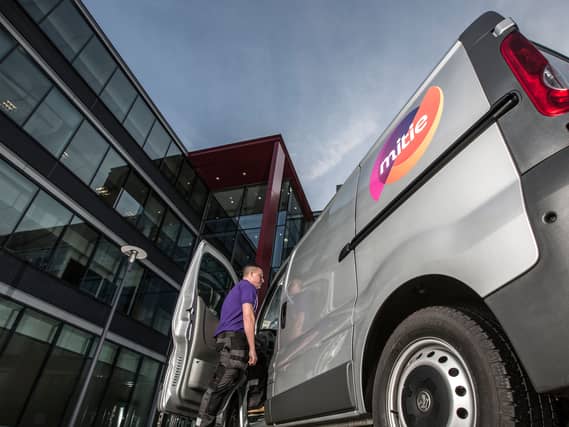 A man next to a Mitie van